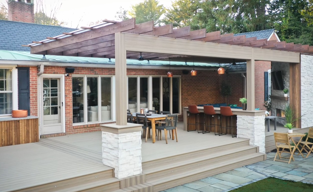 Custom deck with pergola and outdoor kitchen in Manchester, NH